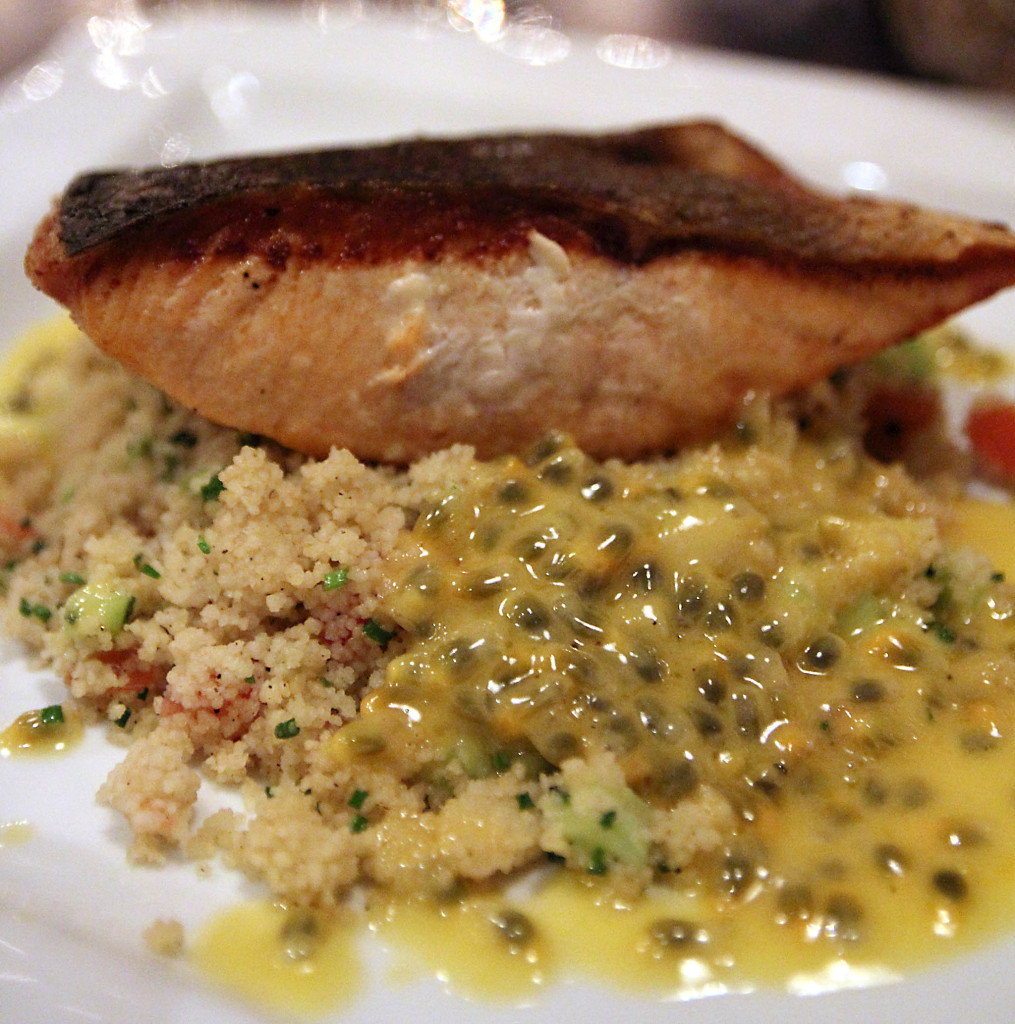 Salmon with couscous and a creamy sauce with passion fruit
